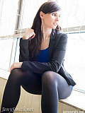 Jeny in black seamless opaque pantyhose spreads her legs in public place